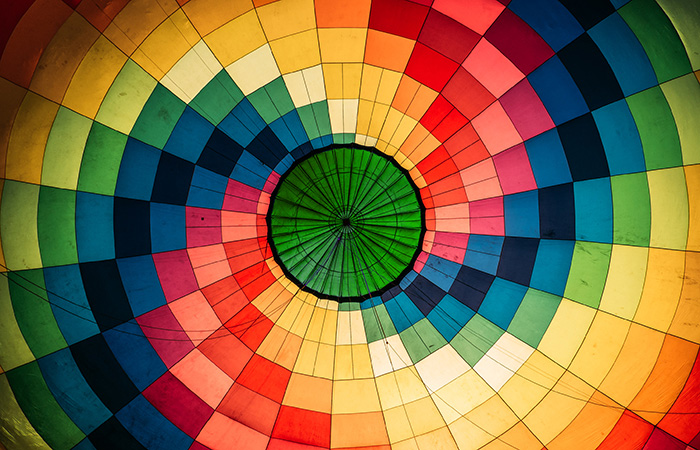 The inside of a hot air balloon canopy with a green center