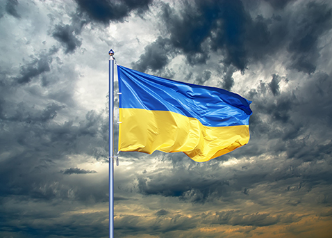 The flag of Ukraine against dramatic clouds