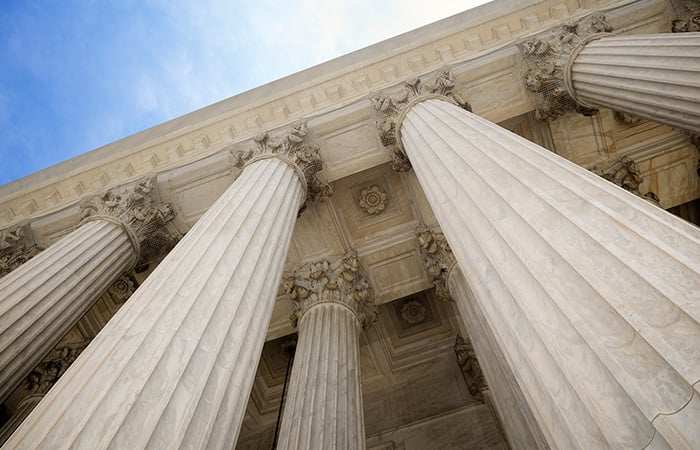 Columns of a courthouse looking up
